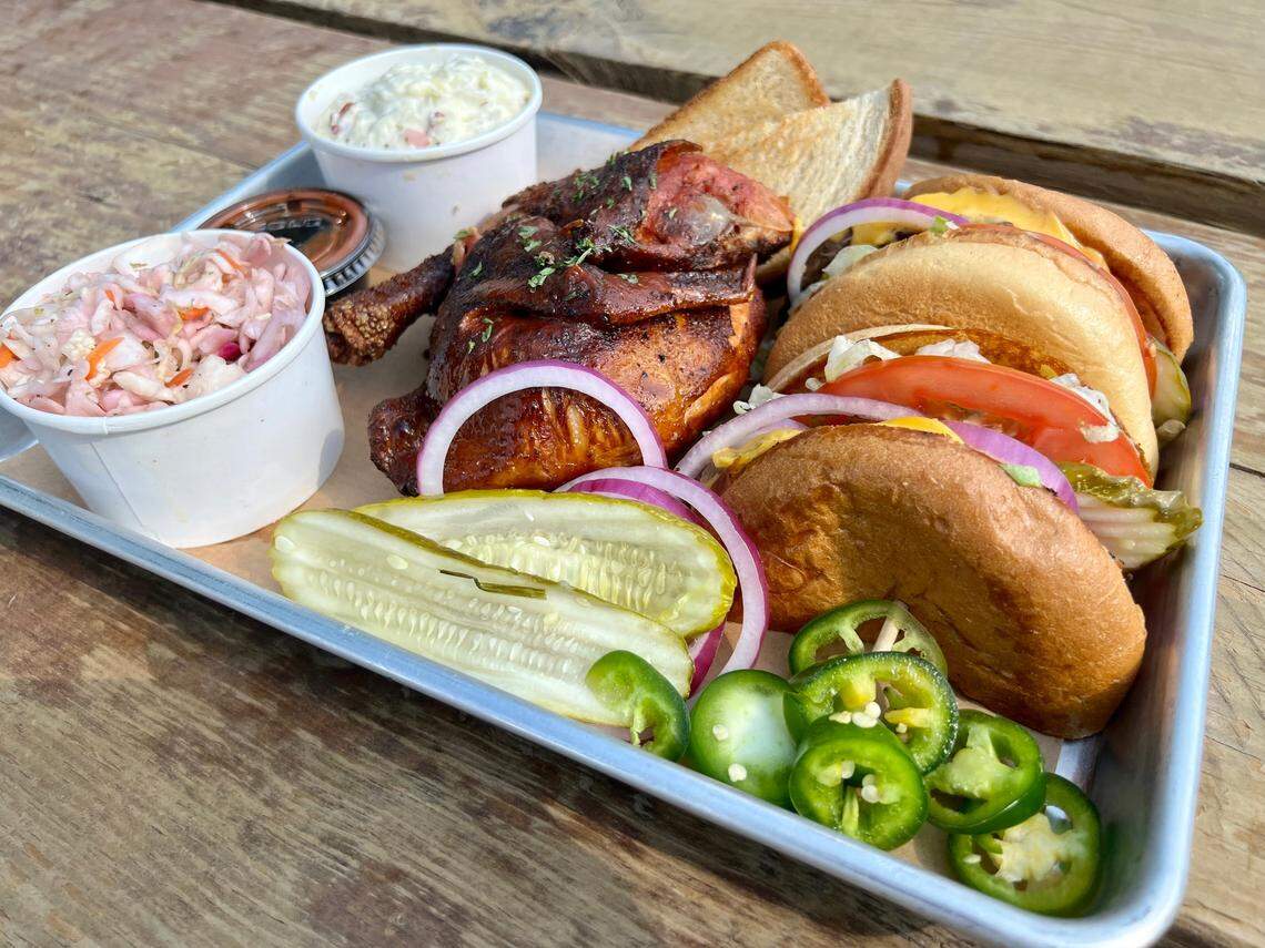 A smoked chicken plate plus a cheeseburger with potato salad and cole slaw at Smokestack 1948.