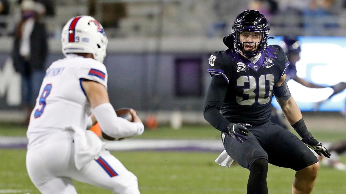 TCU linebacker Garret Wallow (30) had to pull out of this week’s Senior Bowl after testing positive for COVID-19.