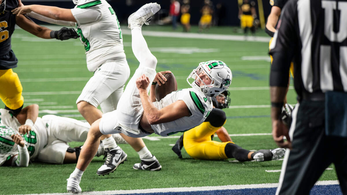 Paradise quarterback Ayden Winters dives into the end zone for the Panthers first score against Malakoff in a Class 3A Division 1 state quarterfinal on Thursday, Dec. 12, 2024 at the Ford Center in Frisco, Texas.
