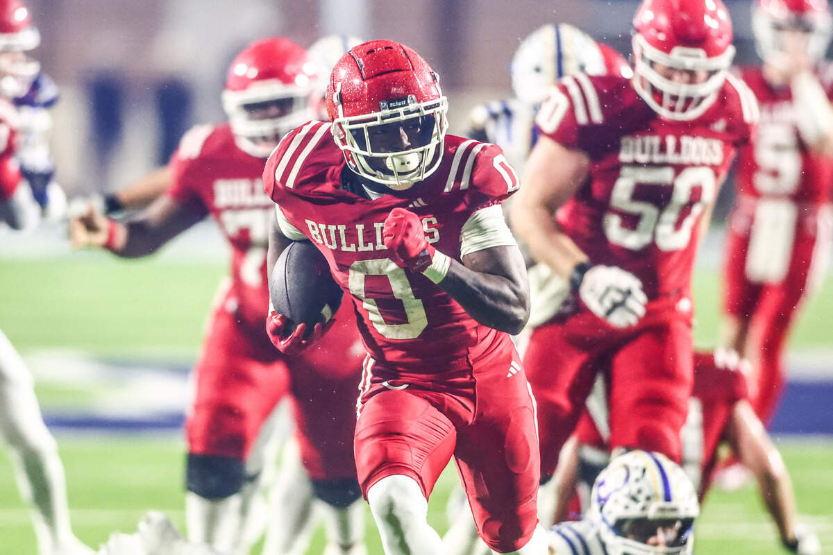 Carthage running back Kelwin Edwards scores in the 4A Division II state semifinal Friday, Dec. 13, playoff game at McKinney ISD Stadium.