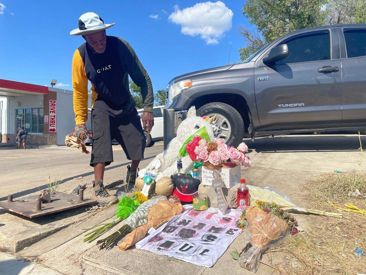 A Como resident paid his respects for Paul Willis, an 18-year-old who was fatally shot at a July 3 gathering Monday night. People have added flowers and things that Willis liked to the memorial. Willis died at the scene and two other victims died at the hospital.