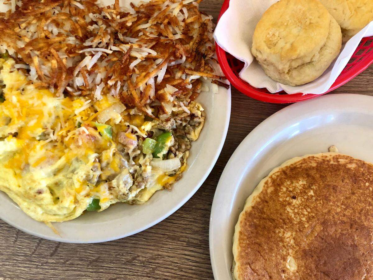 A junkyard omelet, pancake and biscuits at Skillet & Grill restaurant in Arlington.
