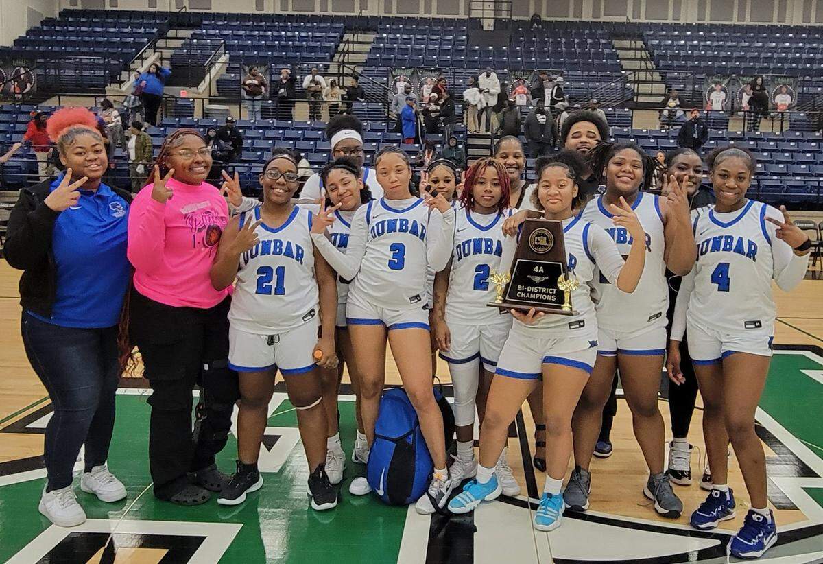 The Fort Worth Dunbar girls basketball team poses after defeating Ferris, 66-40, in a Class 4A bi-district game on Monday, February 12, 2024 at Lake Ridge High School in Mansfield, Texas. Dunbar improves to 23-8 and will face Van Alstyne (20-13) in the area round.
