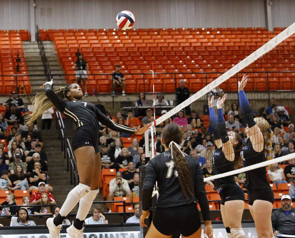 Eagle Mountain middle blocker Keoni Williams (1) delivers a kill shot during the second set of a UIL Conference 4A D2 State Semifinal volleyball playoff game between Eagle Mountain and Spring Hill at Wilkerson-Greines Activity Center in Fort Worth, Texas, Saturday, Nov. 15, 2025.
