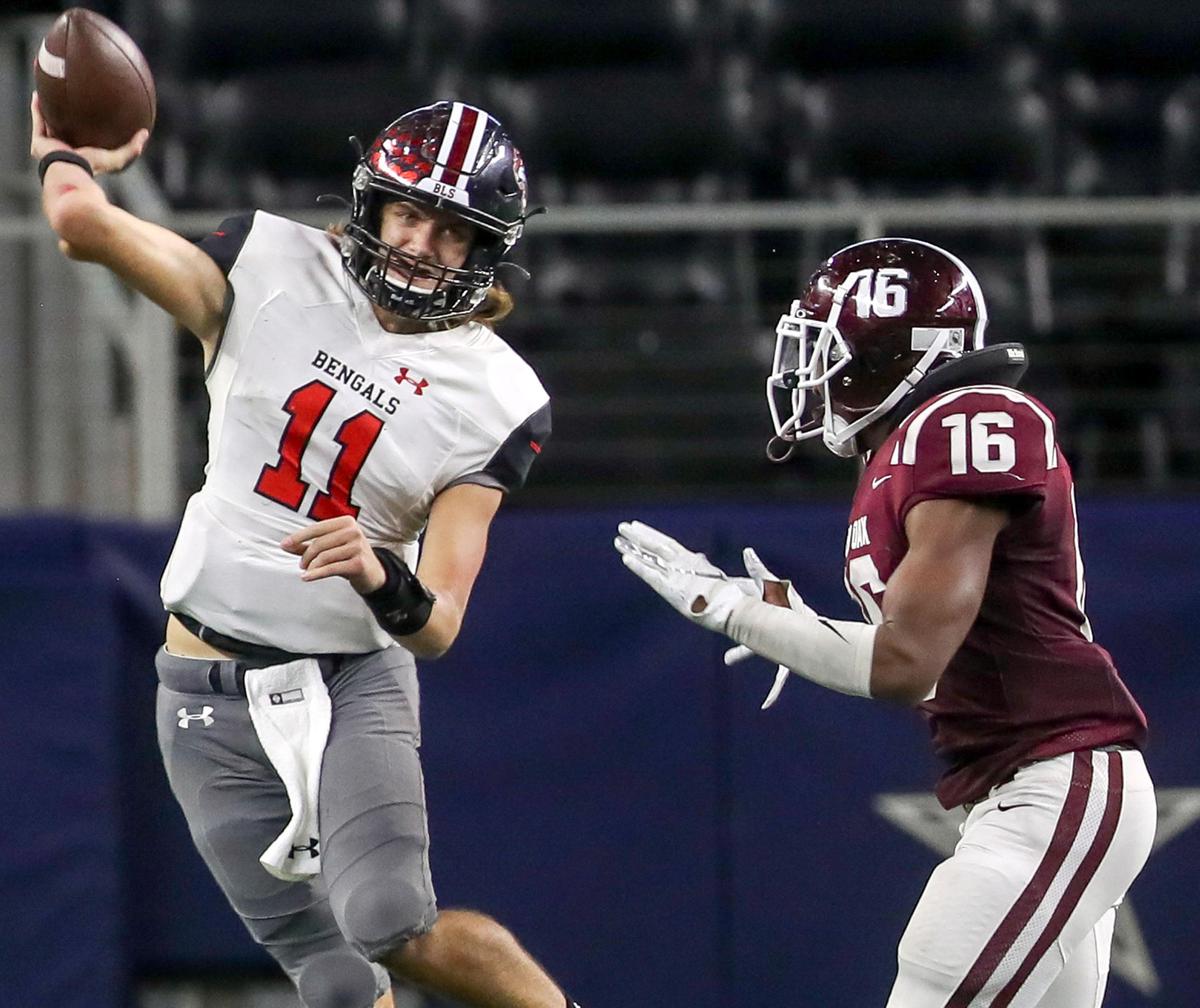 Denton Braswell quarterback Greyson Thompson (11) is pressured by Red Oak linebacker Devin Steen (16) during the second half of their 5A Division II area round high school football playoff game at AT&T Stadium in Arlington, Tx Saturday November 23, 2019.
