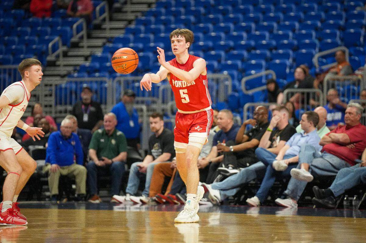 Ponder’s Carter Eddy passes off against Holliday in a Class 3A state semifinal on Thursday, March 7, 2024 at the Alamodome in San Antonio, Texas. Ponder defeated Holliday 62-46 with Eddy scoring a team-high 18 points.