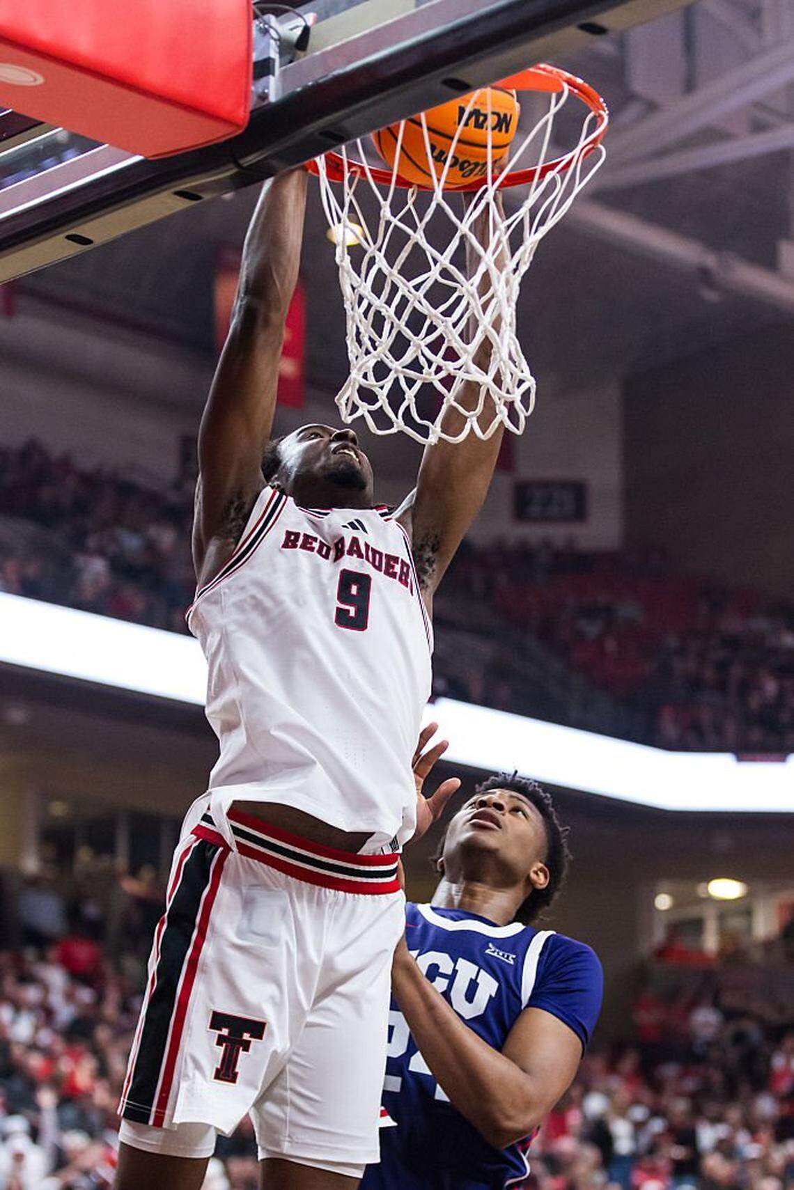 LUBBOCK, TEXAS - MARCH 03: Luke Bamgboye #9 of the Texas Tech Red Raiders dunks the ball during the second half of the game against the TCU Horned Frogs at United Supermarkets Arena on March 03, 2026 in Lubbock, Texas. (Photo by John E. Moore III/Getty Images)
