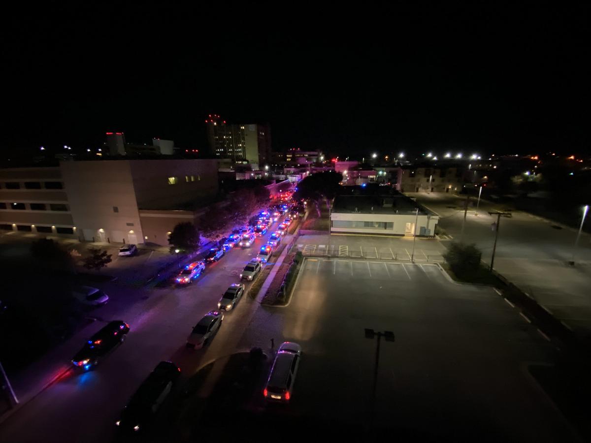 Police escort the body of a Euless detective who died on Saturday from the Tarrant County Medical Examiner’s Office to a funeral home on Sunday, Nov. 28, 2021.