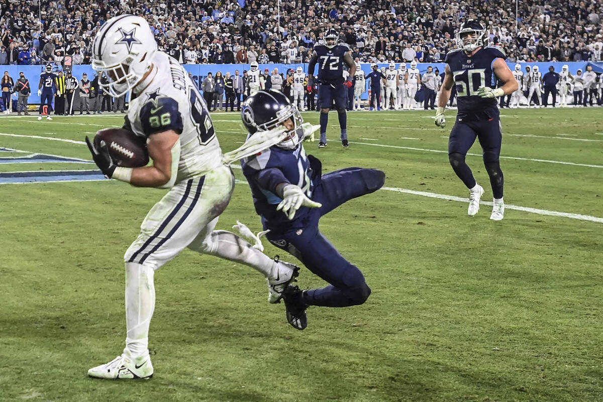 Dallas Cowboys tight end Dalton Schultz (86) scores his second touchdown of the game against Tennessee on Thursday.