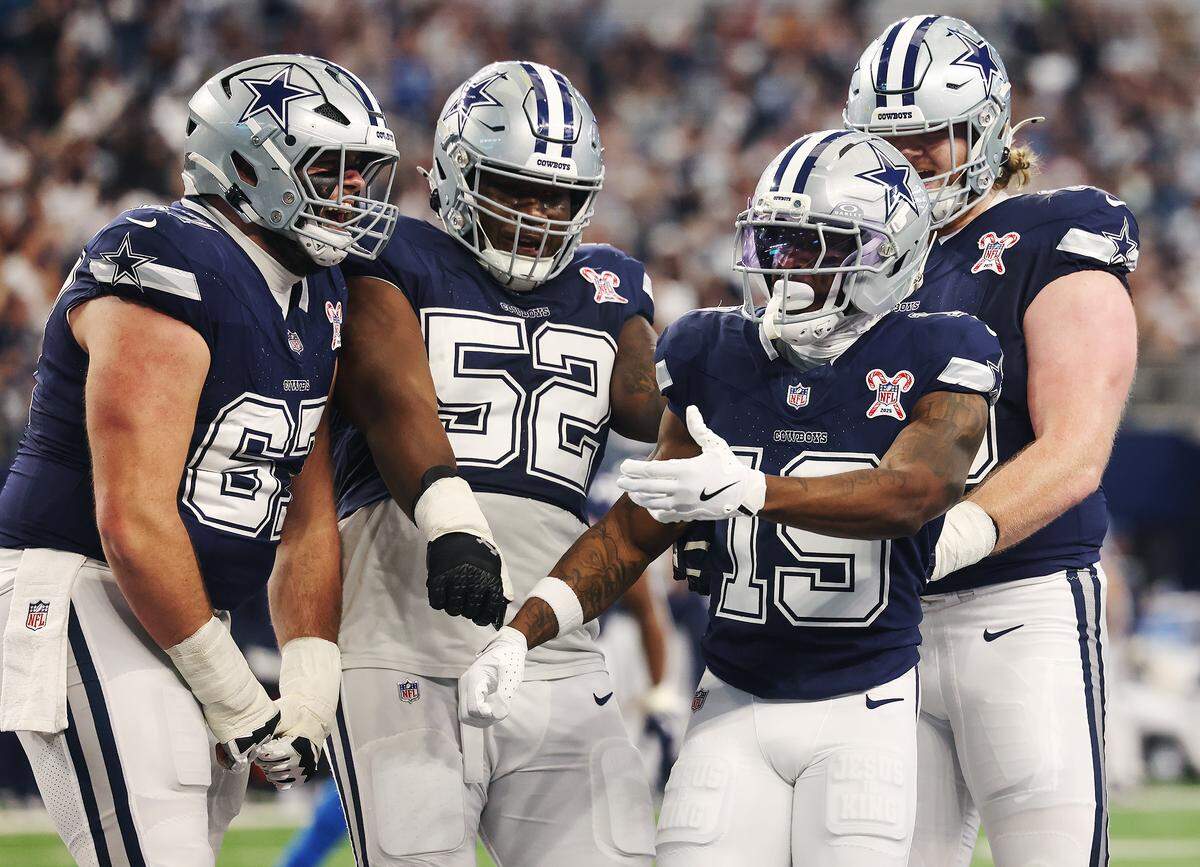 Dallas Cowboys wide receiver Ryan Flournoy (19) celebrates a touchdown with teammates on Sunday, Dec. 21, 2025, at AT&T Stadium.