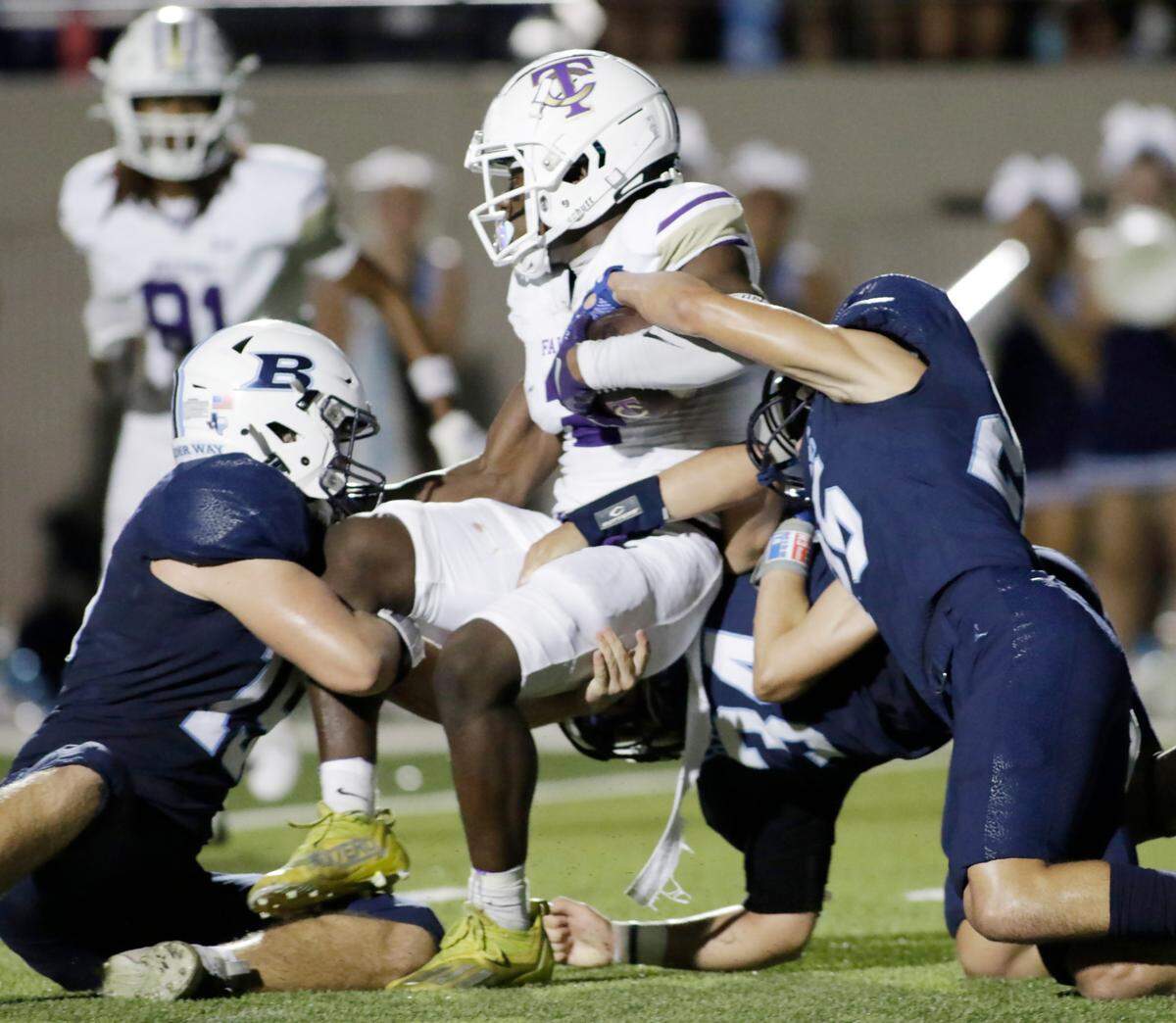 Timber Creek’s Caleb Mendji is stopped just short of the goal line by L.D. Bell tacklers during their UIL football game Friday night at Pennington Field in Hurst on Friday Sept. 6, 2024.