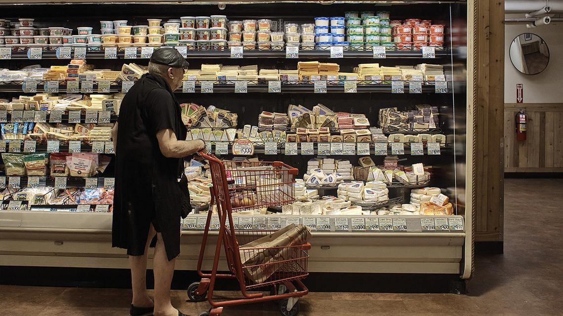 A man shops at a supermarket on July 27, 2022, in New York. (AP Photo/Andres Kudacki)