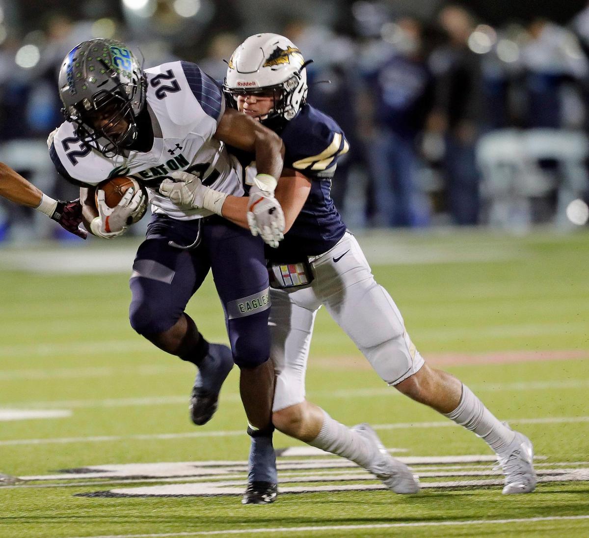Eaton running back Jahbez Hawkins (22) is brought down by Keller’s Zach O’Day during a high school football game at KISD Stadium in Keller, Texas, Thursday, Nov. 05, 2020. The game was tied at seven at the half. (Special to the Star-Telegram Bob Booth)