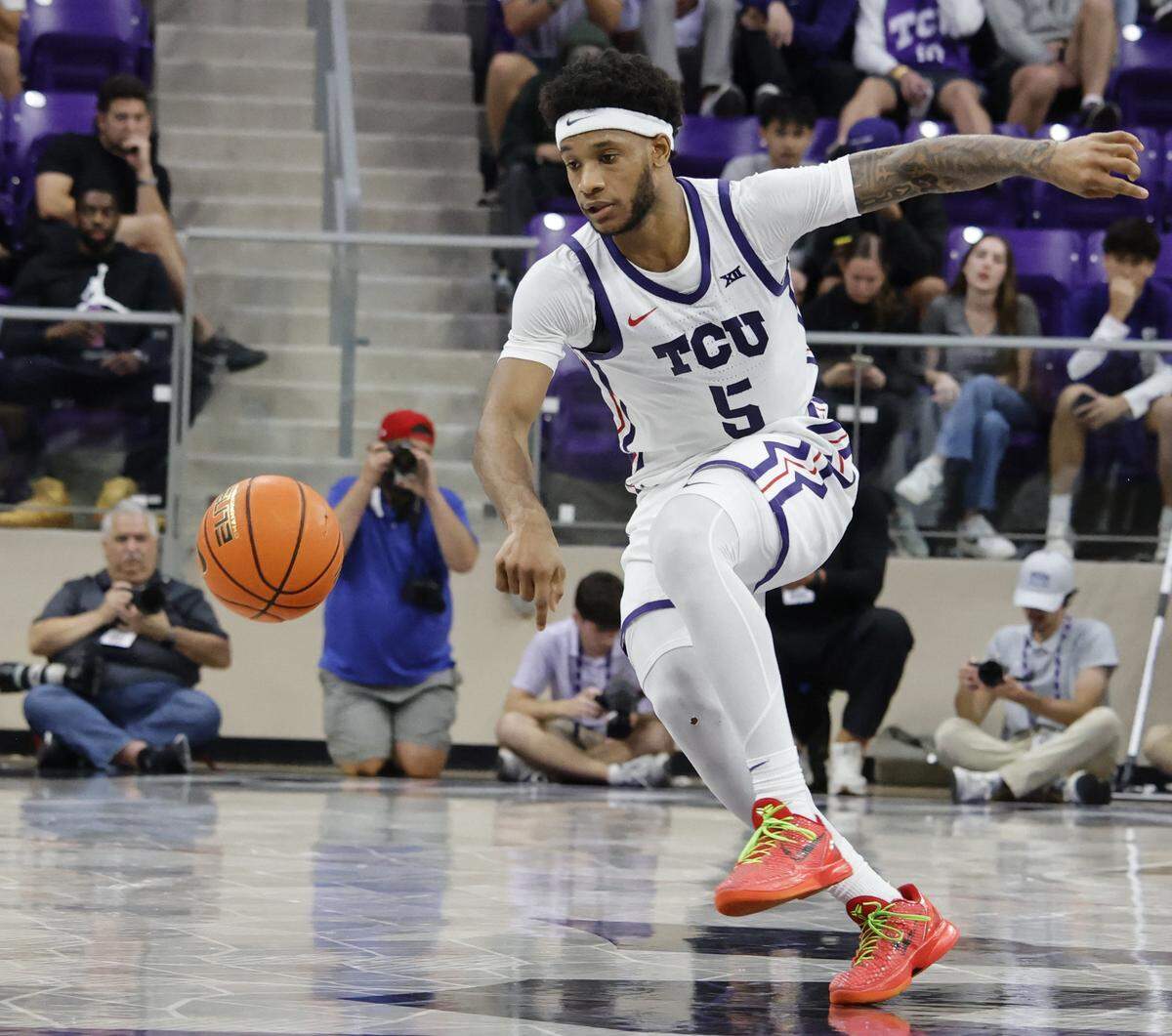 TCU forward Micah Robinson (5) looses footing after getting fouled during the second half of a NCAA basketball game between New Orleans University and TCU at Schollmaier Arena in Fort Worth, Texas, Monday Nov. 03, 2025. The Horned Frogs dropped their home opener 78-74 to the Privateers.