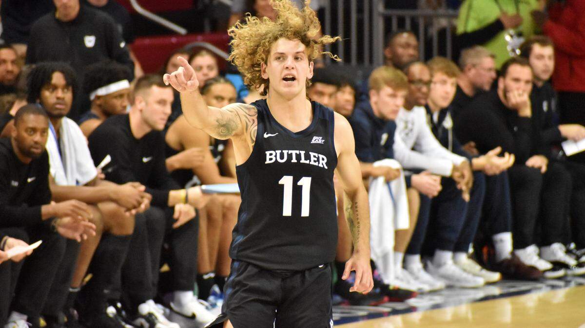Butler’s Finley Bizjack, a former Star-Telegram Player of the Year, points during a game against SMU on Nov. 15 at Moody Coliseum in Dallas.
