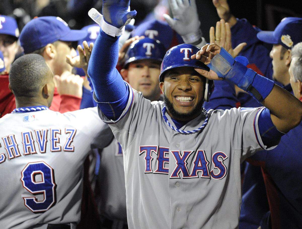 Texas Rangers shortstop Elvis Andrus celebrates scoring the go ahead run in Game 2 of the 2011 World Series. (Star-Telegram file photo)