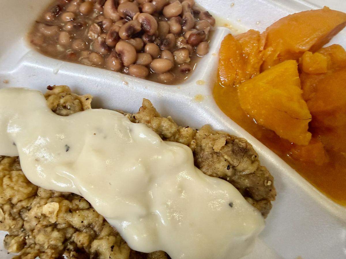 A lunch portion of chicken-fried steak with black-eyed peas and sweet potatoes at Drew’s Place in Fort Worth, Texas, seen Oct. 21, 2025.