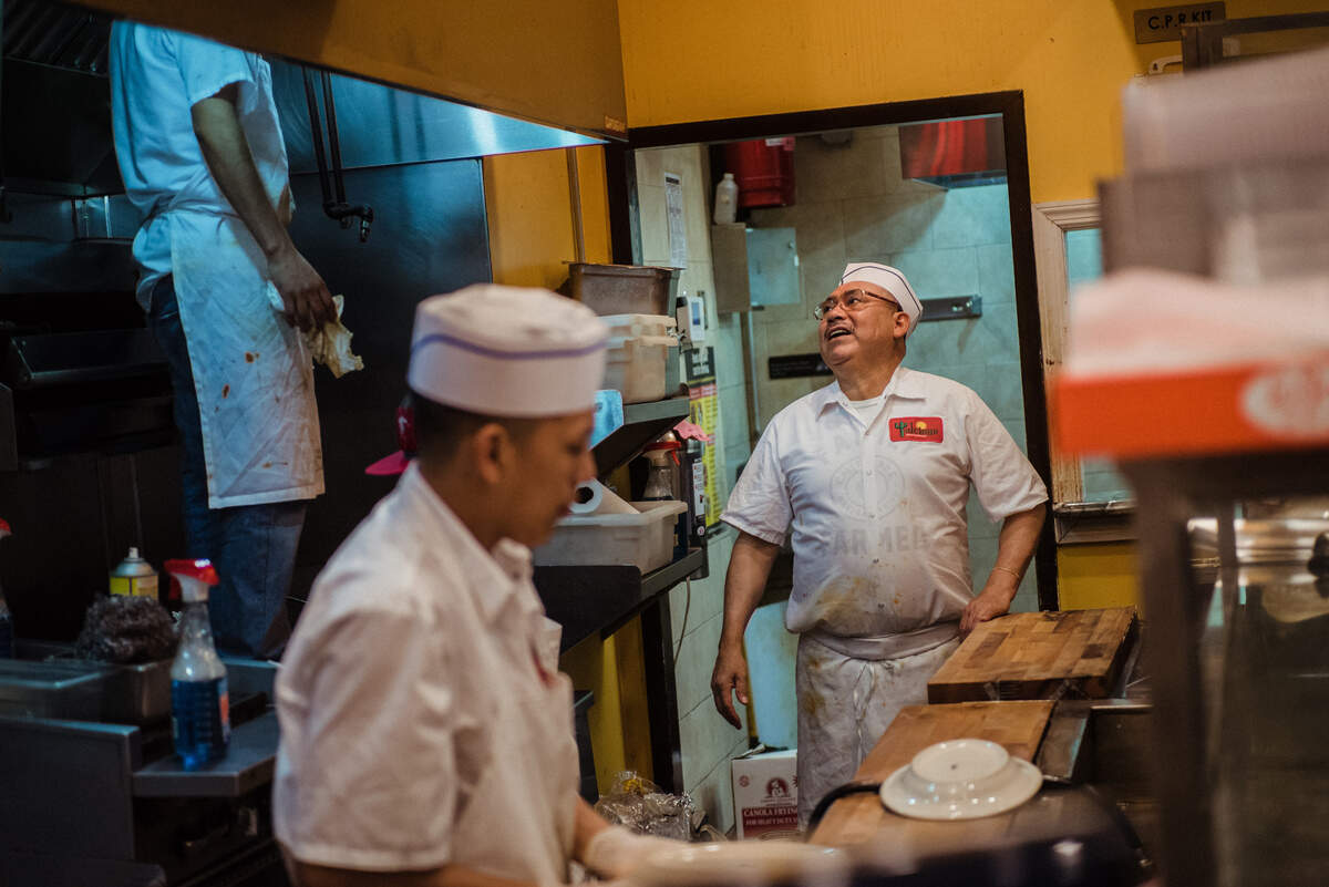 Amado, right, while working at Tulcingo Mexican restaurant in Jackson Heights, Queens, on March 24, 2019. Most of Amados time is spent between his underground home and work at the restaurant. (Ryan Christopher Jones/The New York Times)