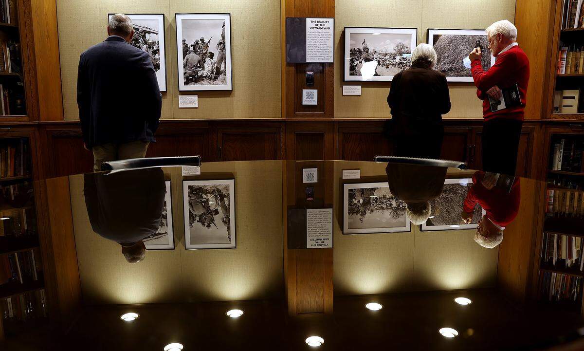 The public views photographs taken by Bob Schieffer while covering the Vietnam War for the Fort Worth Star-Telegram during the opening of the exhibit at UT Arlington on Monday, Feb. 9, 2026, at UT Arlington.