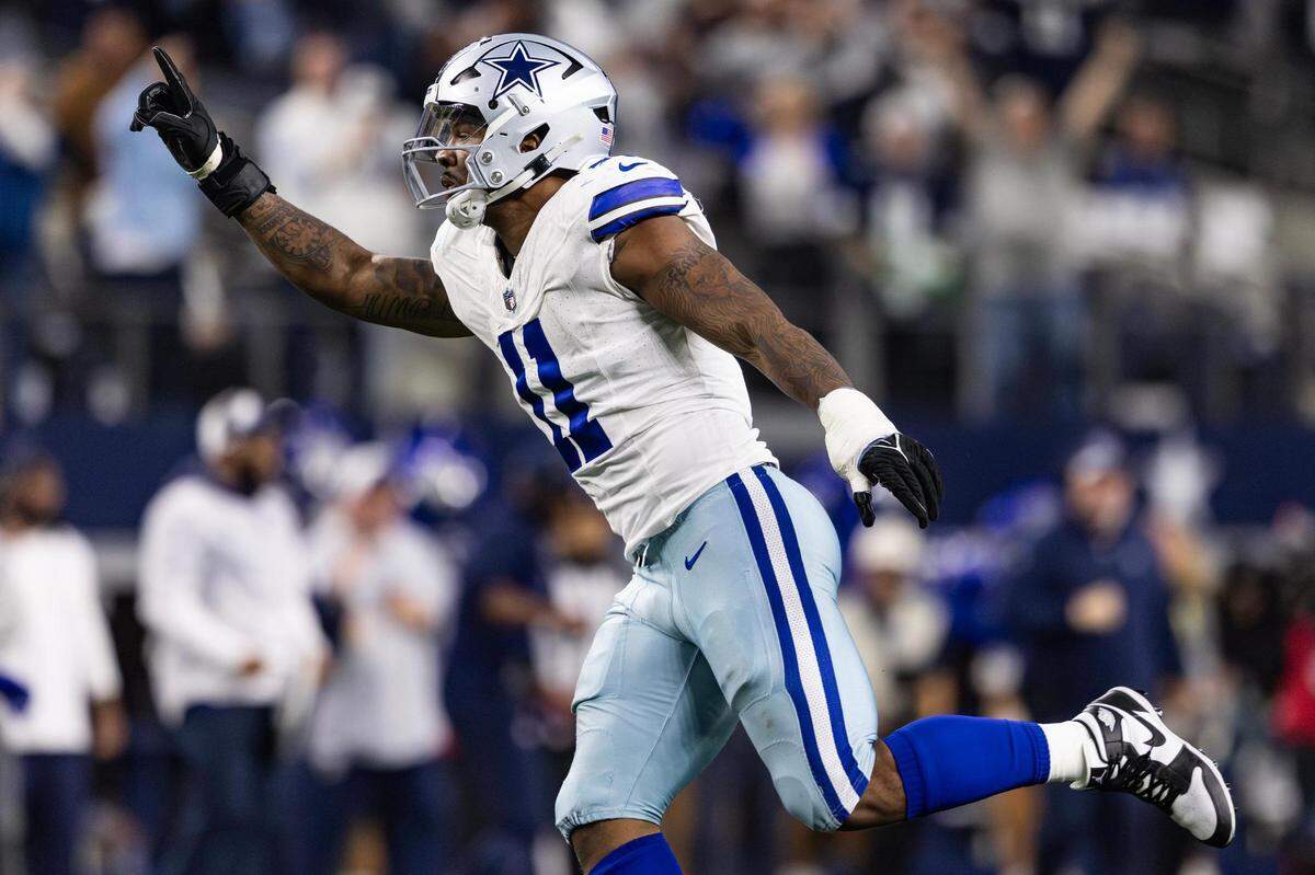 Cowboys linebacker Micah Parsons (11) celebrates after getting a sack on fourth down in the final play of the game in an NFL game between the Dallas Cowboys and the Seattle Seahawks at AT&T Stadium in Arlington on Thursday, Nov. 30, 2023. The Cowboys came out on top 41-35.