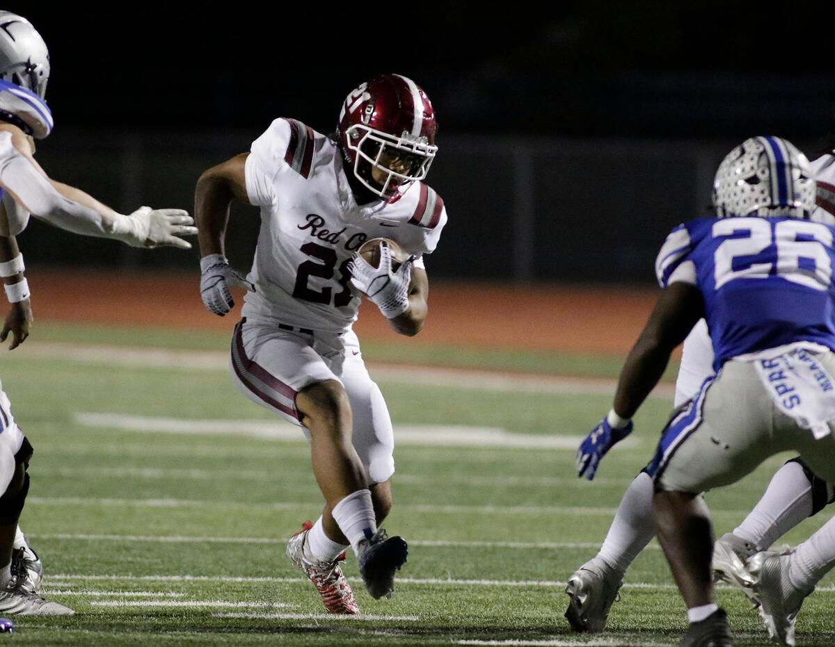 Red Oak’s Lorenzo Holman finds a hole to run through during a UIL football game at Burleson ISD Stadium on Friday October 25, 2024.