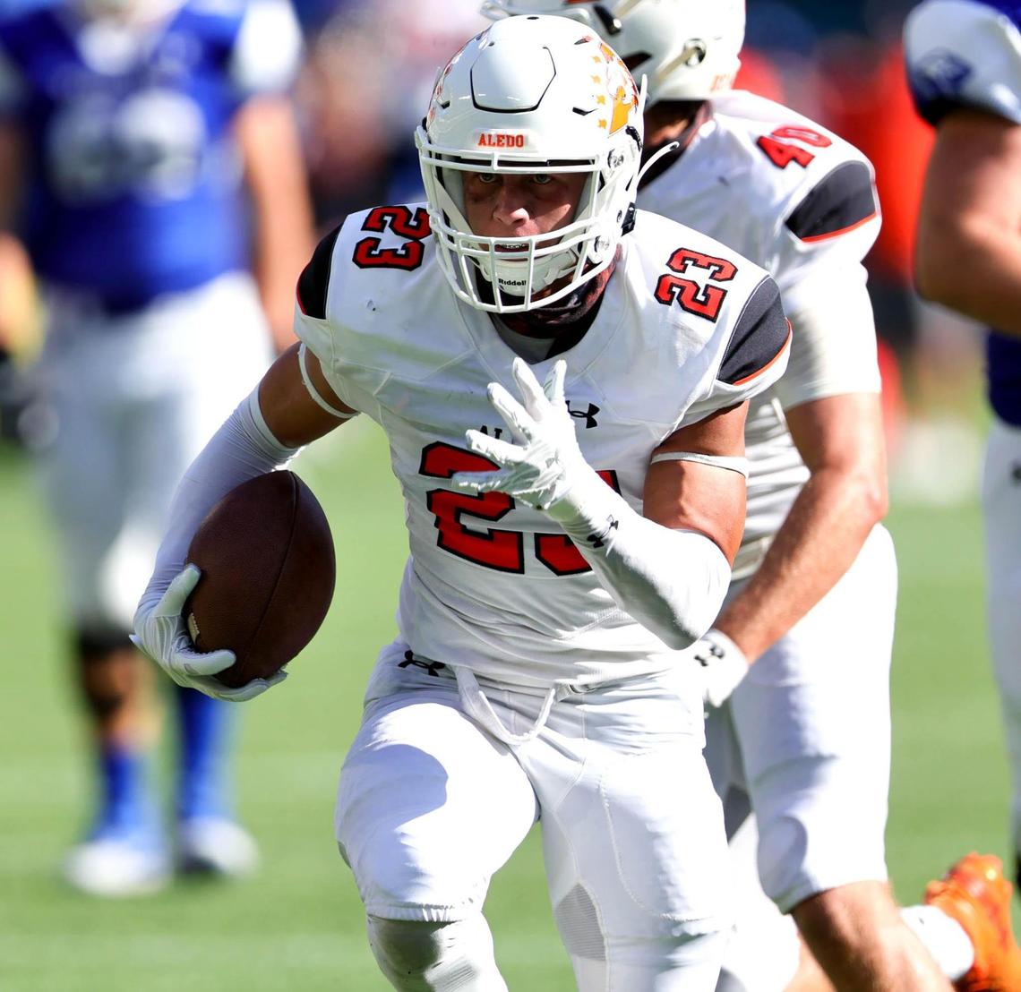 Aledo safety Elijah Valencia (23) runs a fumble return in for a touchdown against Weatherford during the first half, Saturday afternoon, Sepember 26, 2020 played at Globe Life Park in Arlington, TX (Steve Nurenberg Special to the Star-Telegram)