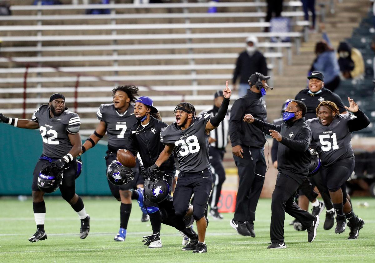 North Crowley players rush the field after winning a high school 6A Division 2 bi-district football playoff game at Globe Life Park in Arlington, Texas, Friday, Dec. 11, 2020. North Crowley defeated Byron Nelson 23-16. (Special to the Star-Telegram Bob Booth)