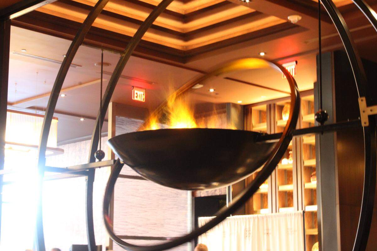 Soy Cowboy in Arlington at the Loews Hotel has a massive flaming chandelier to light up their formal dining room.
