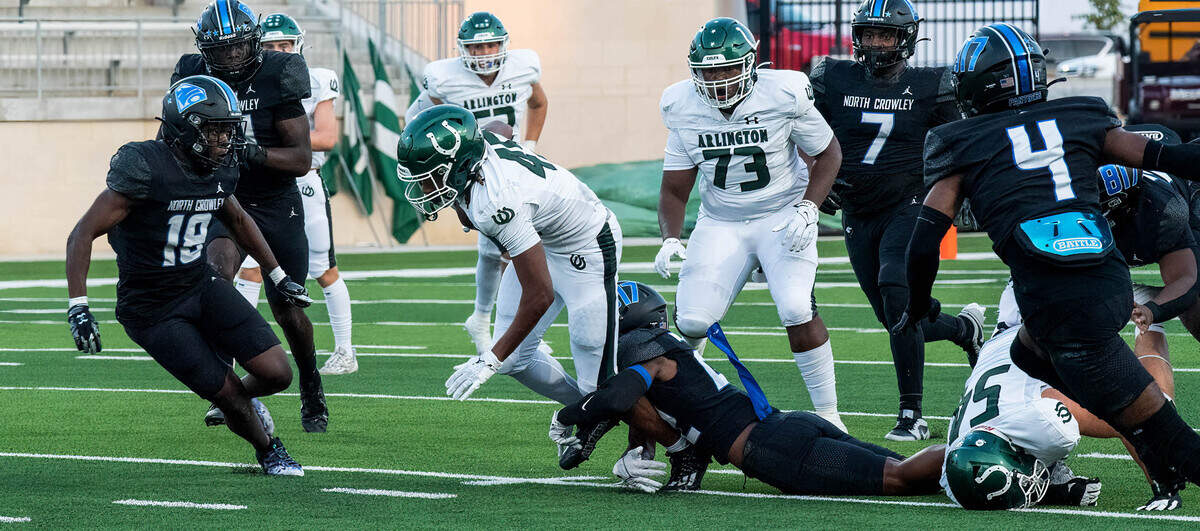 North Crowley’s Gaylon McNeal brings down Arlington receiver Isaiah Robertson on Friday September 1, 2023 at Crowley IDS Stadium in Fort Worth, Texas.