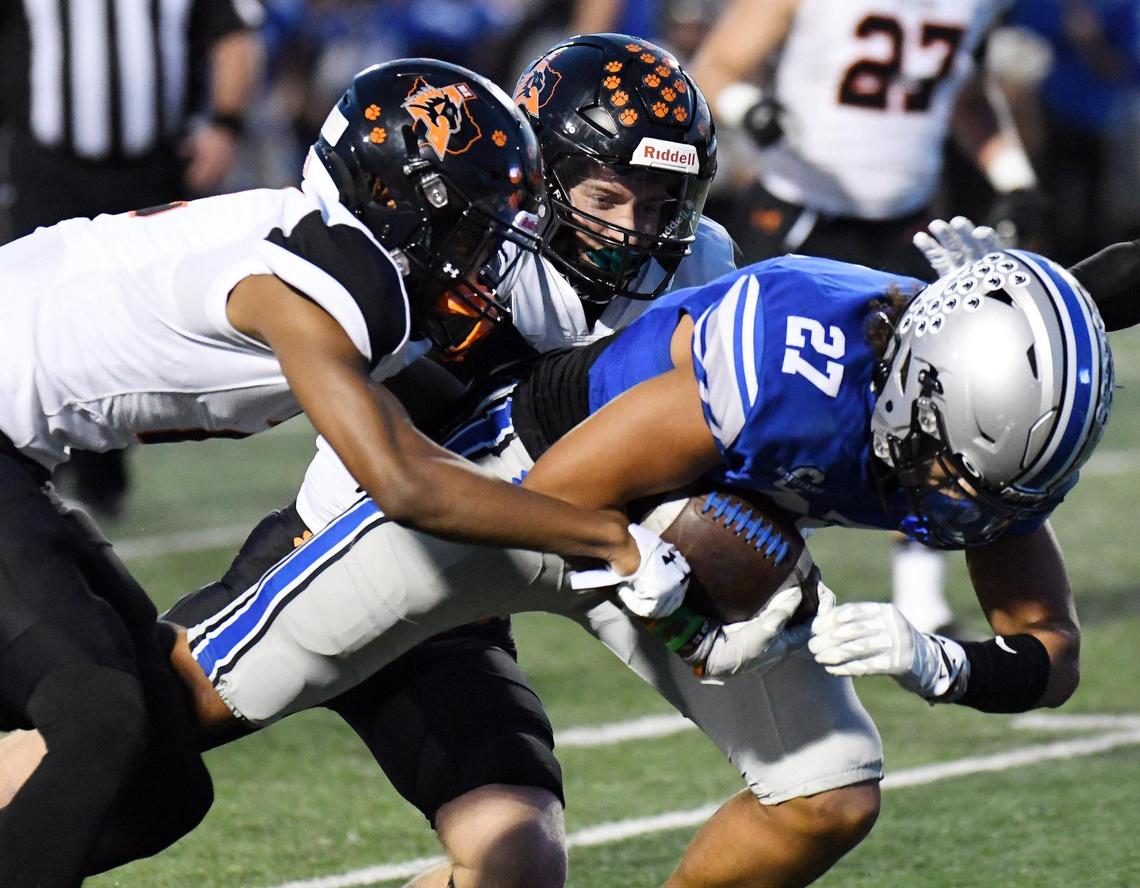 Aledo’s Jaden Allen, left and Cap Mooney bring down Centennial’s Aidan Hicks as he runs for a first down in the first quarter of Friday’s October 14, 2022 District 3-5A Division 1 football game at Burleson ISD Stadium in Burleson, Texas. Special/Bob Haynes