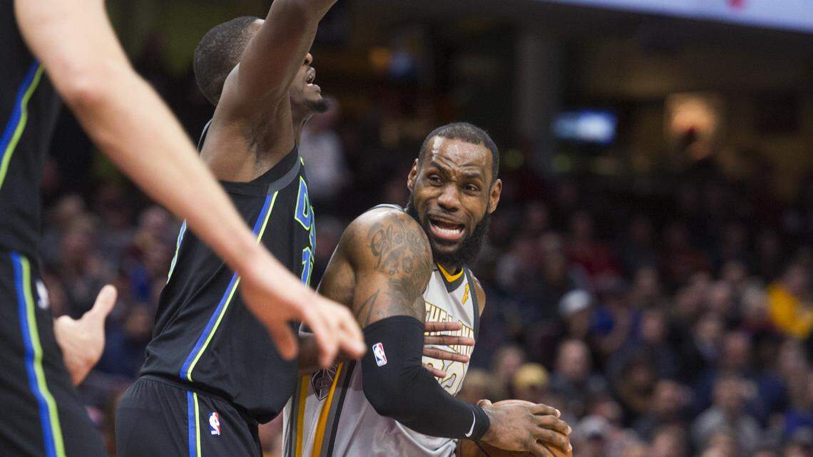 Cleveland Cavaliers' LeBron James (23) drives past Dallas Mavericks' Dorian Finney-Smith during the first half of an NBA basketball game in Cleveland, Sunday, April 1, 2018.