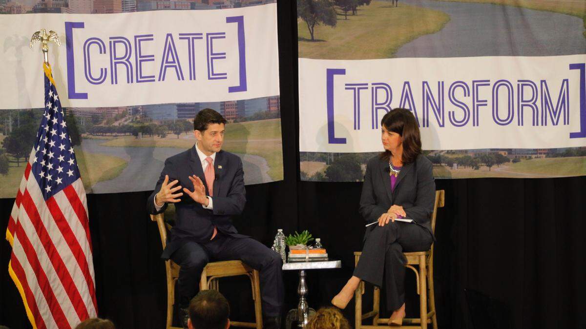 U.S. House Speaker Paul Ryan talks with Heather Reynolds, CEO of Catholic Charities Fort Worth, on Tuesday at a private town hall in Fort Worth.