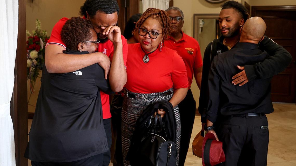 Anthony Johnson Jr.’s parents grieve with family and friends during his funeral on Friday in Mansfield. Johnson was killed while in custody at the Tarrant County jail in April.