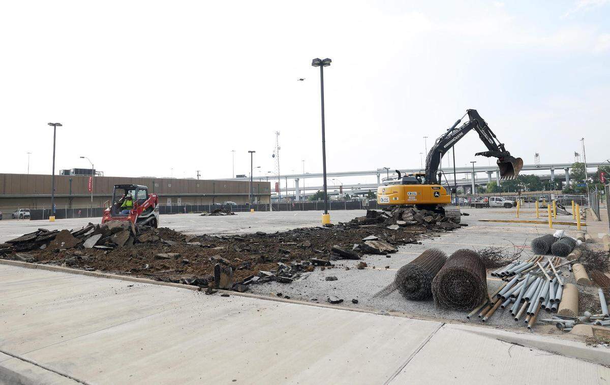 Machines begin to break apart the concrete over the which will become Texas A&M-Fort Worth’s new $150 million Law and Education Building on Wednesday in downtown Fort Worth.