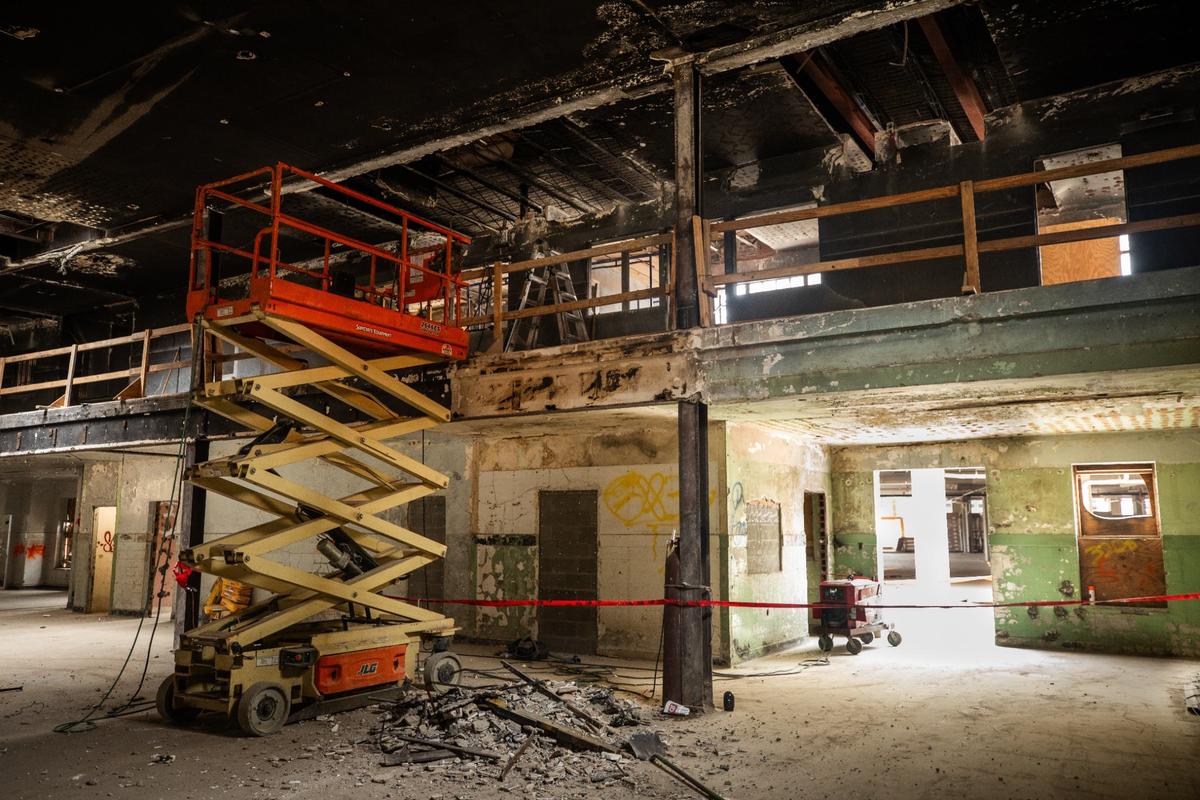 A scissor lift and debris from construction on the Fort Worth Public Market Wednesday, July 17, 2024. The market caught fire on July 2022 and what caused it was never determined.