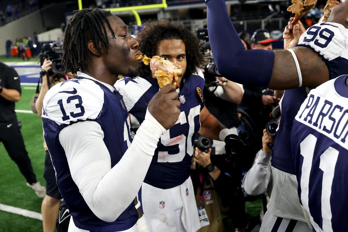 Dallas Cowboys linebacker DeMarvion Overshown (13) celebrates the Thanksgiving Day win against the New York Giants with his teammates on Thursday, Nov. 28, 2024, at AT&T Stadium in Arlington.