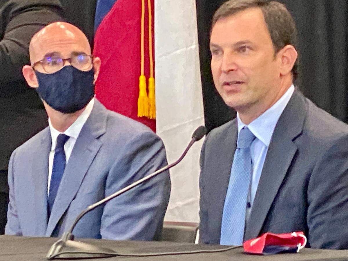 State Rep. Craig Goldman, R-Fort Worth, talks as House Speaker Dennis Bonnen, R-Angleton, looks on at a Gov. Greg Abbott press conference in Fort Worth.