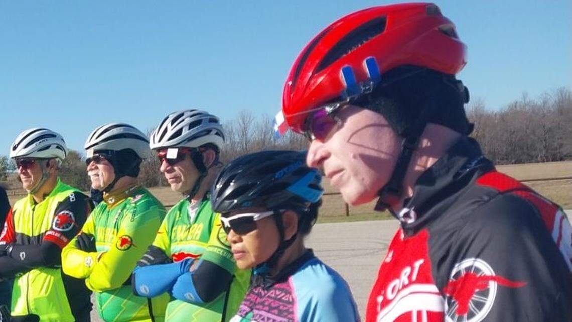 Cyclists at Benbrook Lake listen to the announcement from Army Corps of Engineers officials on Saturday that the campground will remain open to bicycles and pedestrians.