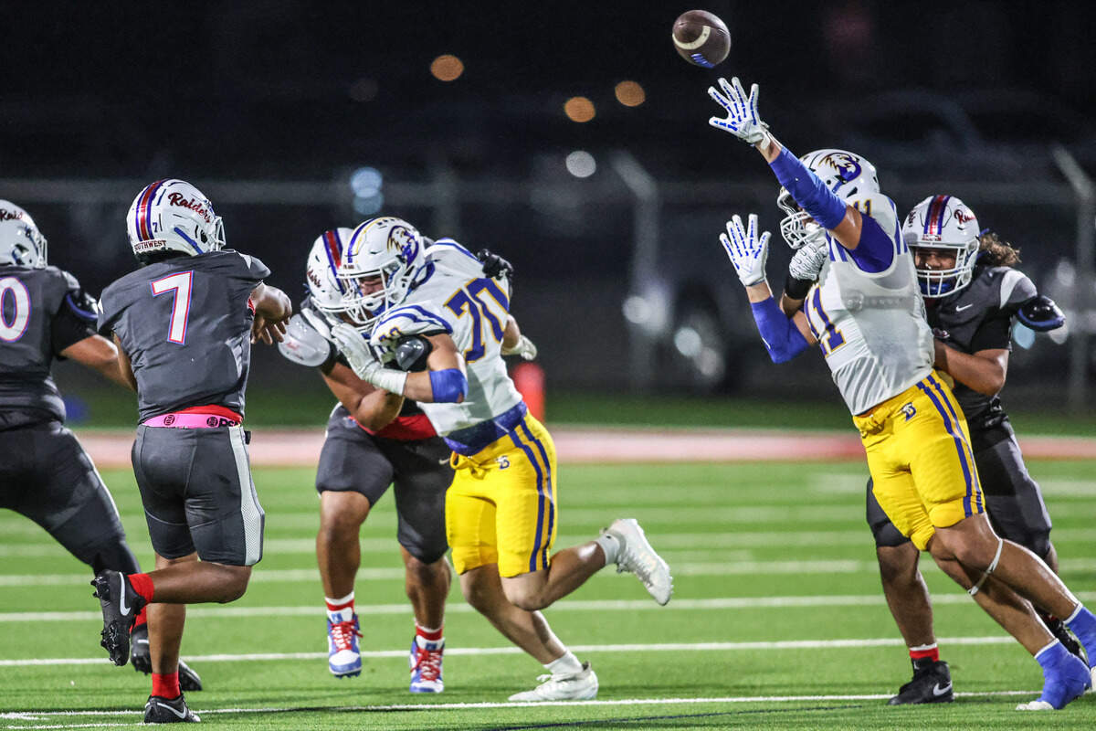 Fort Worth Southwest quarterback Zachariah Cain (7) is pressured by Brock’s RJ Cannon (70) and Caleb Holt (11) on Thursday, Sept. 18, 2025 at Scarborough-Handley Field in Fort Worth, Texas.