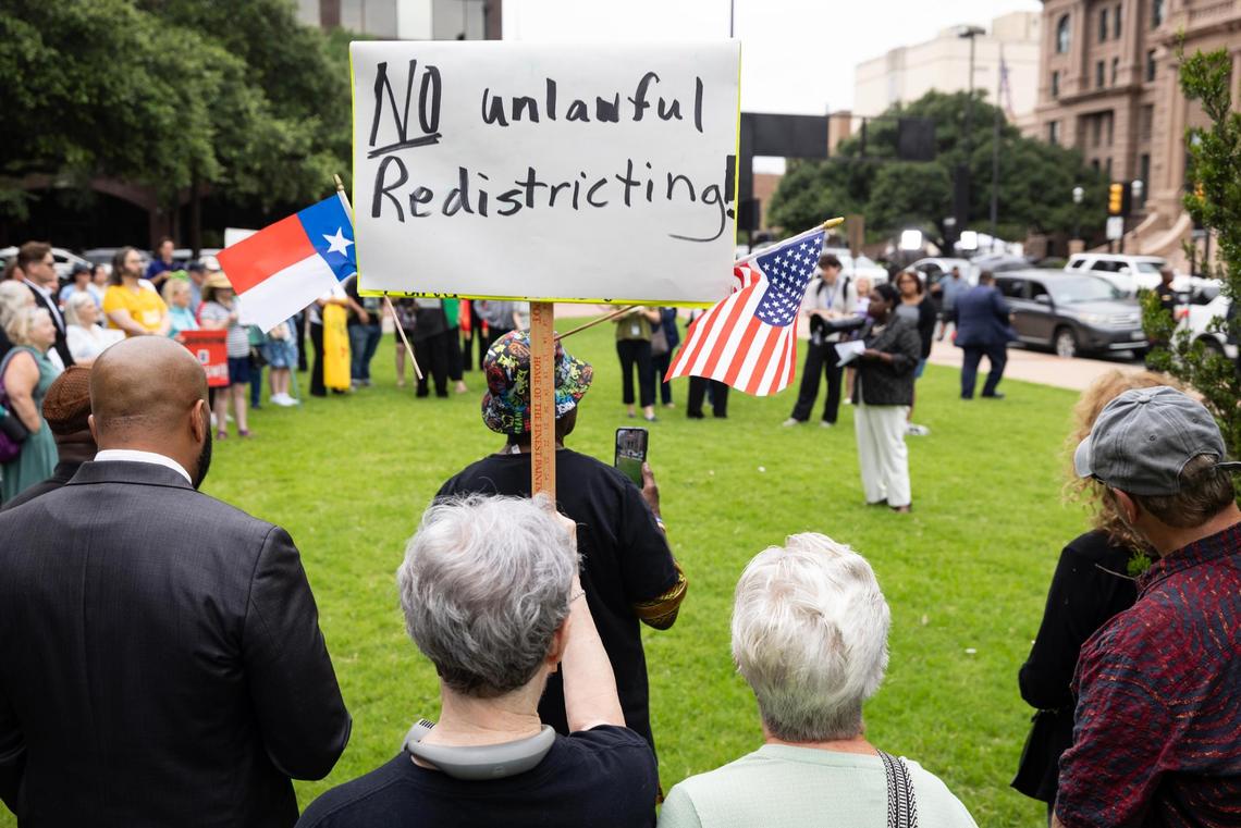 Community members rally outside of the G.K. Maenius Administration Building on Tuesday, June 3, 2025, to protest the proposed redistricting of Tarrant County.