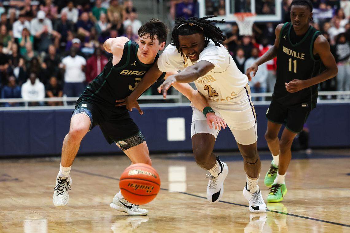 Birdville guard Brandon Lohmann (3) fights off Denton’s Jason Lester (2) in an attempt to grab the loose ball in a UIL Class 5A Division I regional final at Flower Mound High School in Flower Mound, Texas, Friday, March 6, 2026.