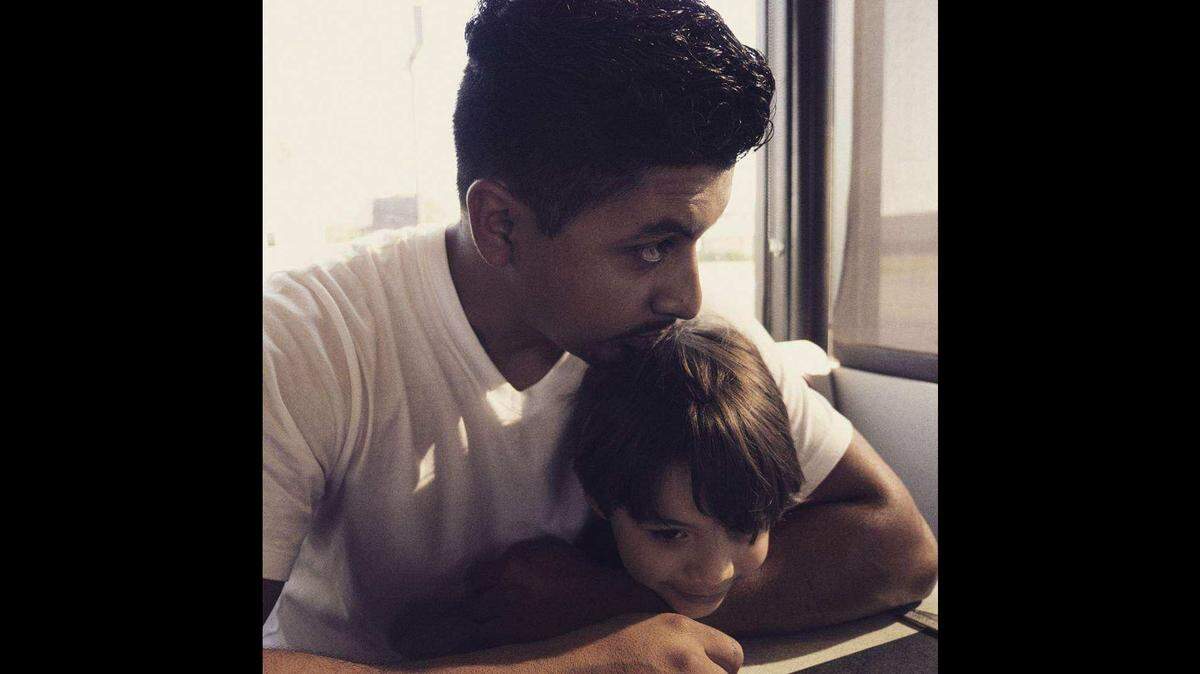 Carlos Delgadillo (left) shares a tender moment with his son in this provided photo. Fort Worth police have said that his brother, Ricardo Delgadillo, intentionally shot him to death in 2019 and then lied to officers by saying it was an accident. In July 2025, a jury found Ricardo guilty of murder.