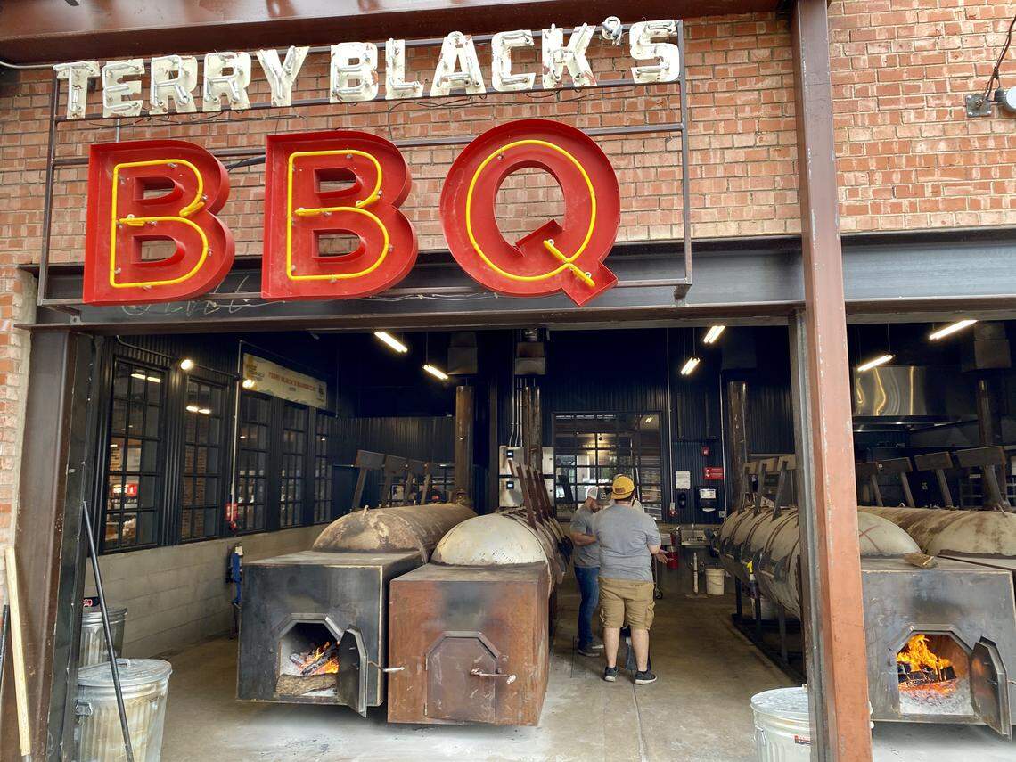 Fire pits welcome the patrons at Terry Black’s Barbecue.