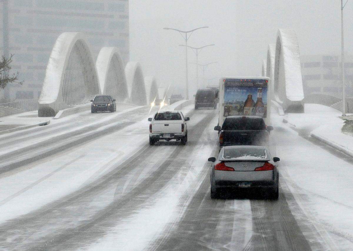 Feb. 27, 2015: Morning traffic crosses the snow-covered West Seventh Street bridge in Fort Worth.