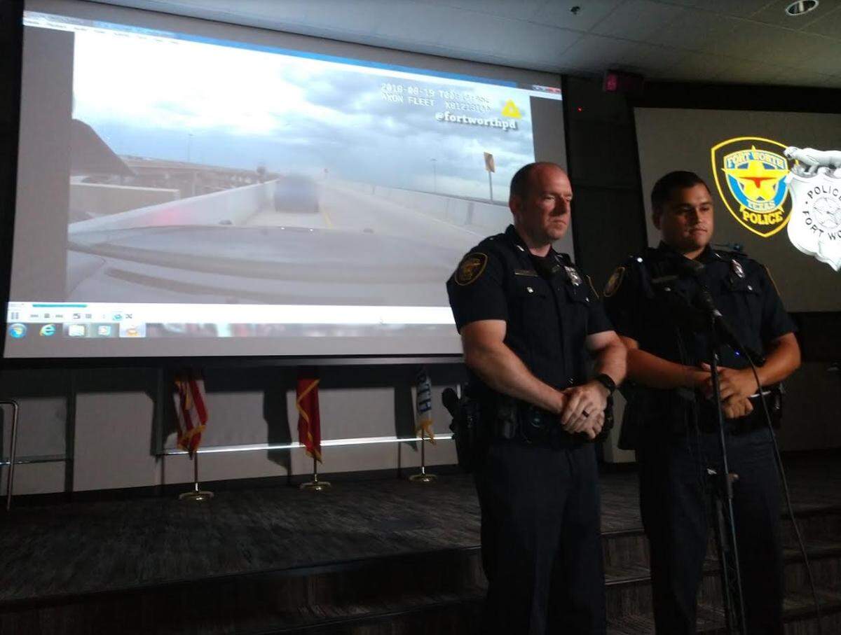 Fort Worth officers Justin Henry (l), and Trae Cierzan talked Thursday afternoon about how they saved a woman from jumping off a highway bridge.