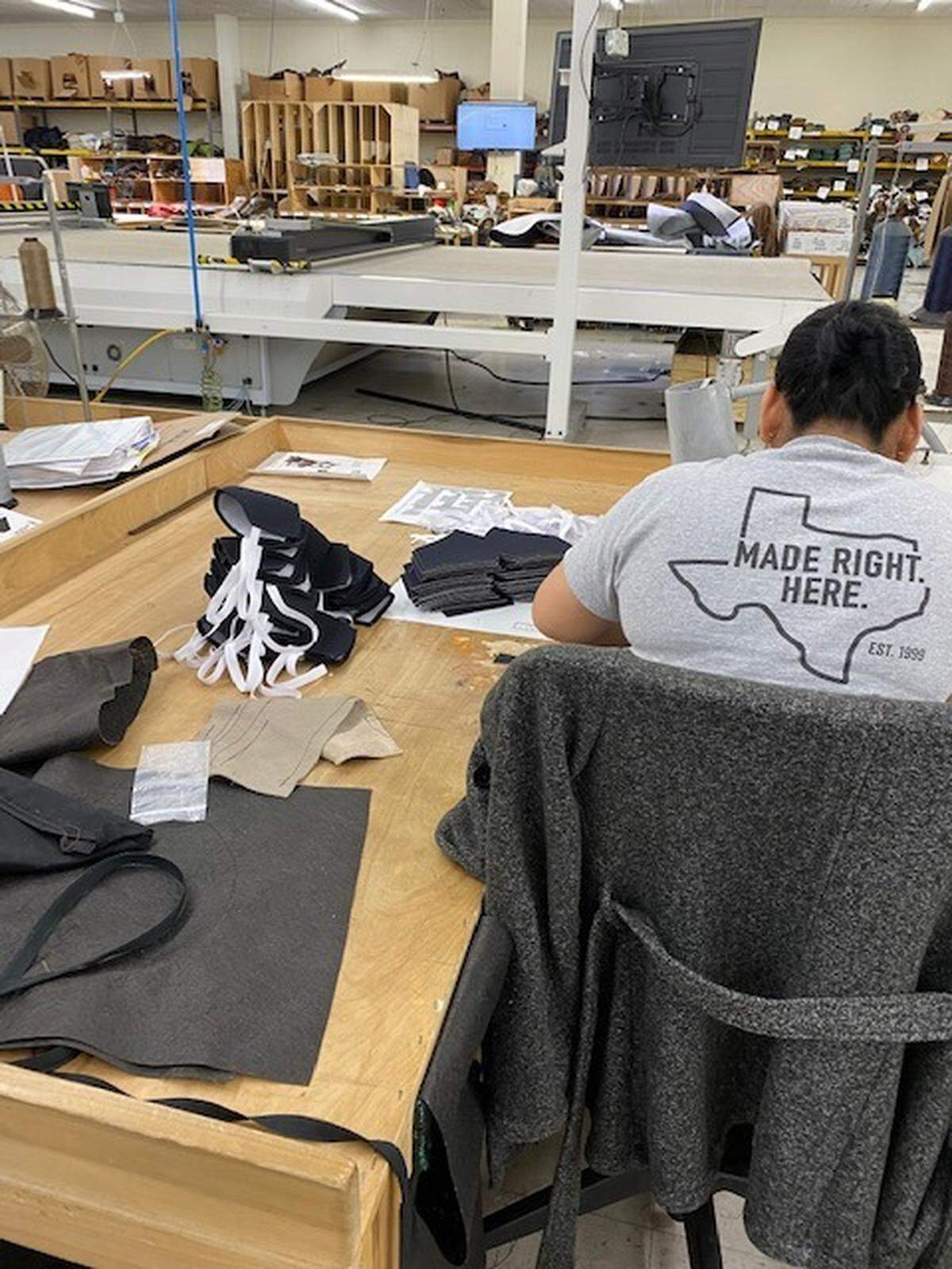 An employee of The Leather Sofa Co. works on making a face mask that could soon be used by a North Texas medical professional. The furniture company has transitioned to making protective masks to help hospitals that are running low due to the coronavirus.