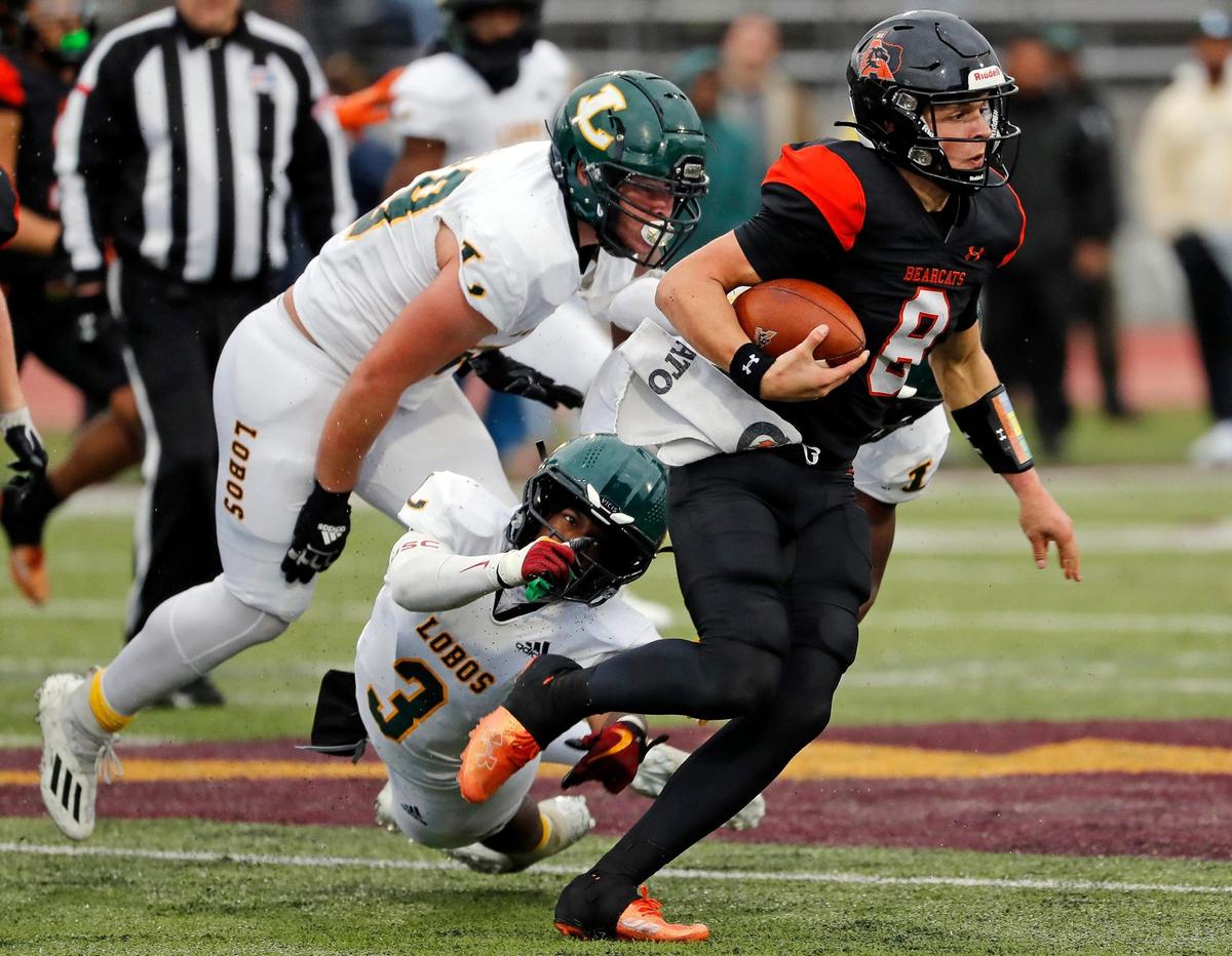 Aledo quarterback Hauss Hejny (8) gains yards up the middle on a keeper in the second half of a UIL Class 5A D1 state semifinal football game at the John Kincaide Stadium in Dallas, Texas, Saturday, Dec. 10, 2022. Under several weather delays Aledo led Longview 17-14 with :56 seconds remaining in the game. (Special to the Star-Telegram Bob Booth)