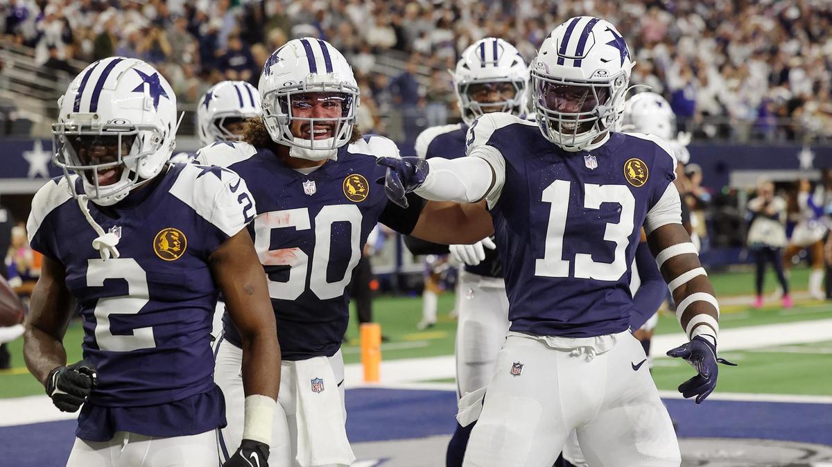 Dallas Cowboys linebacker DeMarvion Overshown (13) celebrates celebrates with teammates after scoring a touchdown on a recovered ball against the New York Giants on Thursday, Nov. 28, 2024, at AT&T Stadium in Arlington.