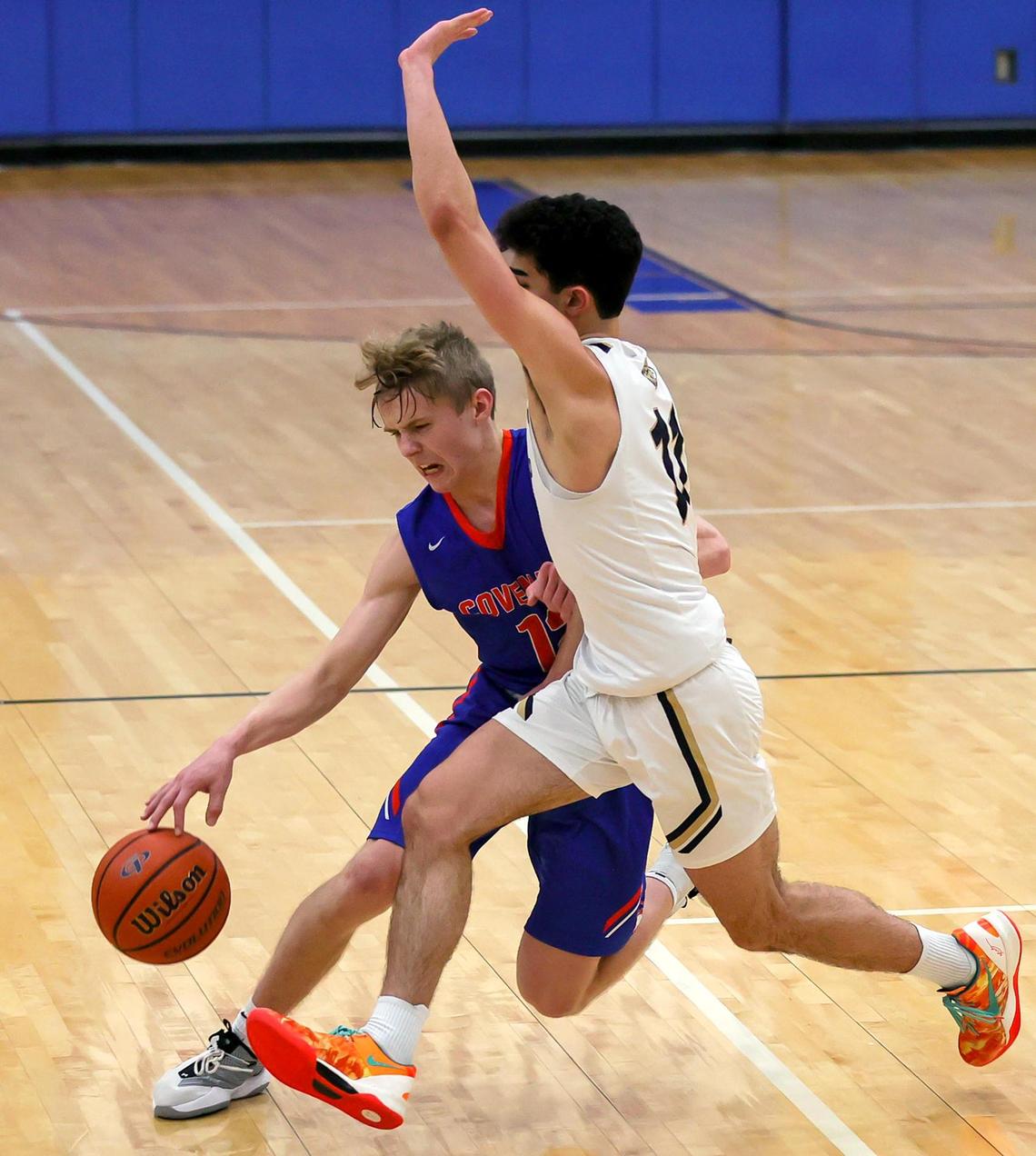 Colleyville Covenant guard Caleb Turner (L) tries to get around Arlington Grace Prep guard Auri Bidgoli (R) during the second half of a TAPPS 4A Regional Round Boys Basketball playoff game played on March 6, 2021 at Brewer High School in Fort Worth TX. (Steve Nurenberg Special to the Star-Telegram)