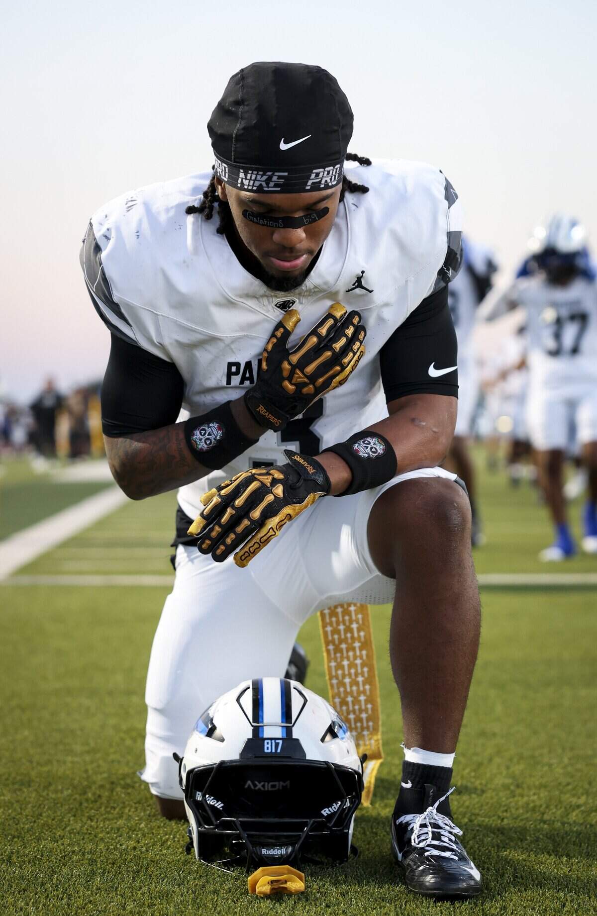 North Crowley running back G’yrell Smith (3) prays before the game against Waxahachie on Friday, Oct. 9, 2026, at Stuart B. Lumpkins Stadium in Waxahachie.